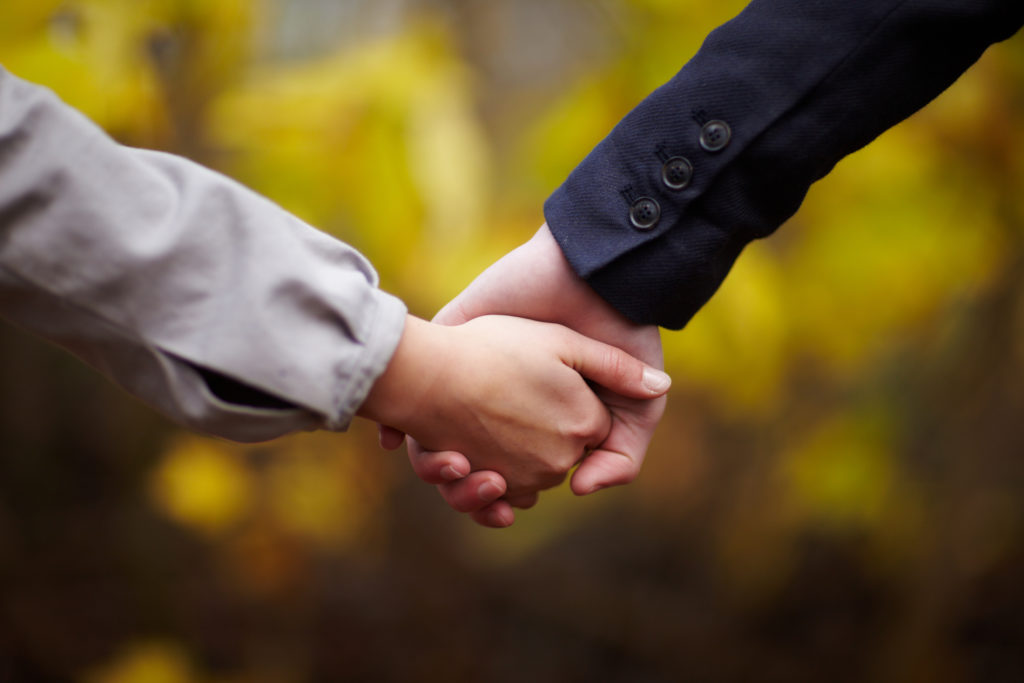 Romance - Caucasian Couple holding hands in fall